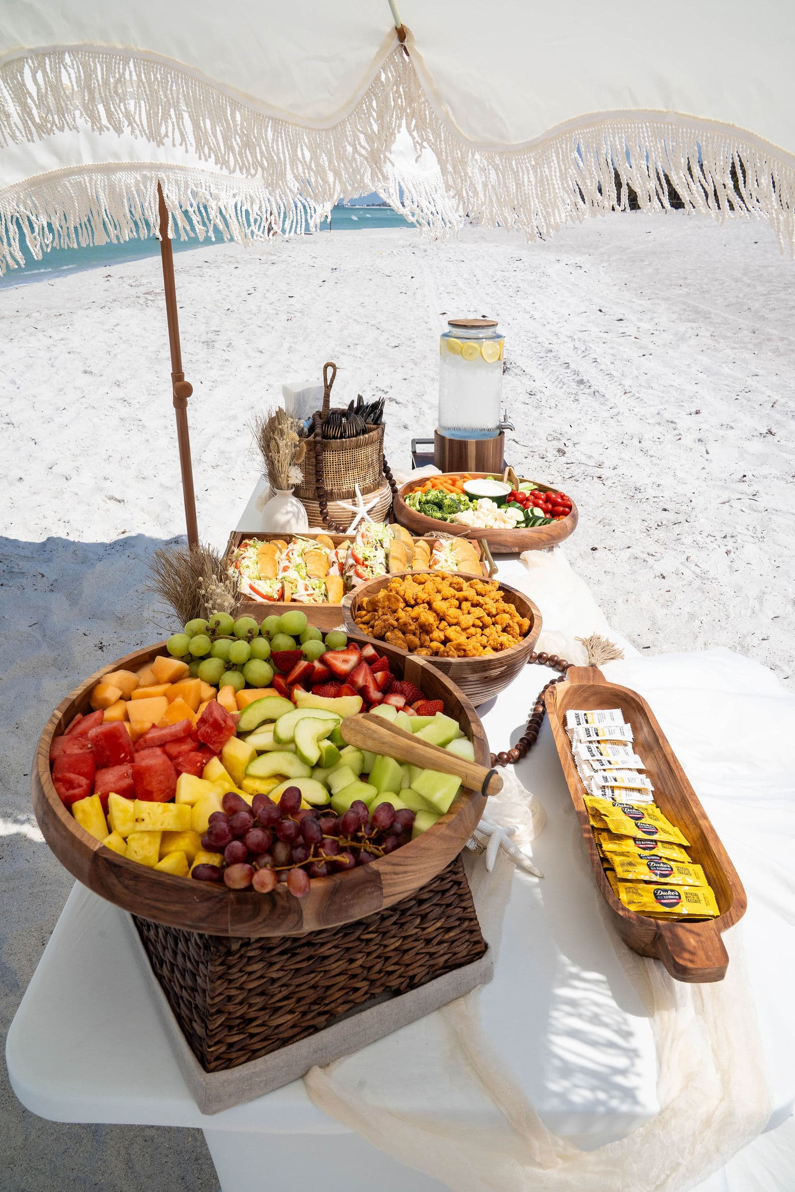 Florida beach wedding couple with tropical flower arrangements, real client ceremony photo