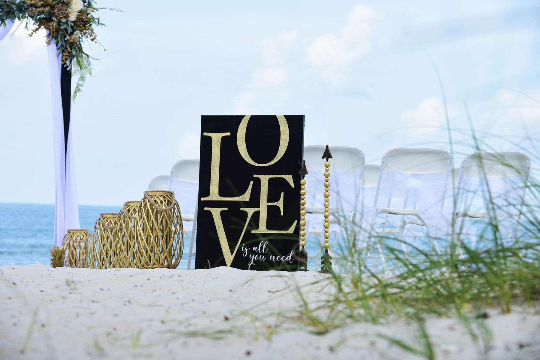 Wedding setup on a sandy beach with a