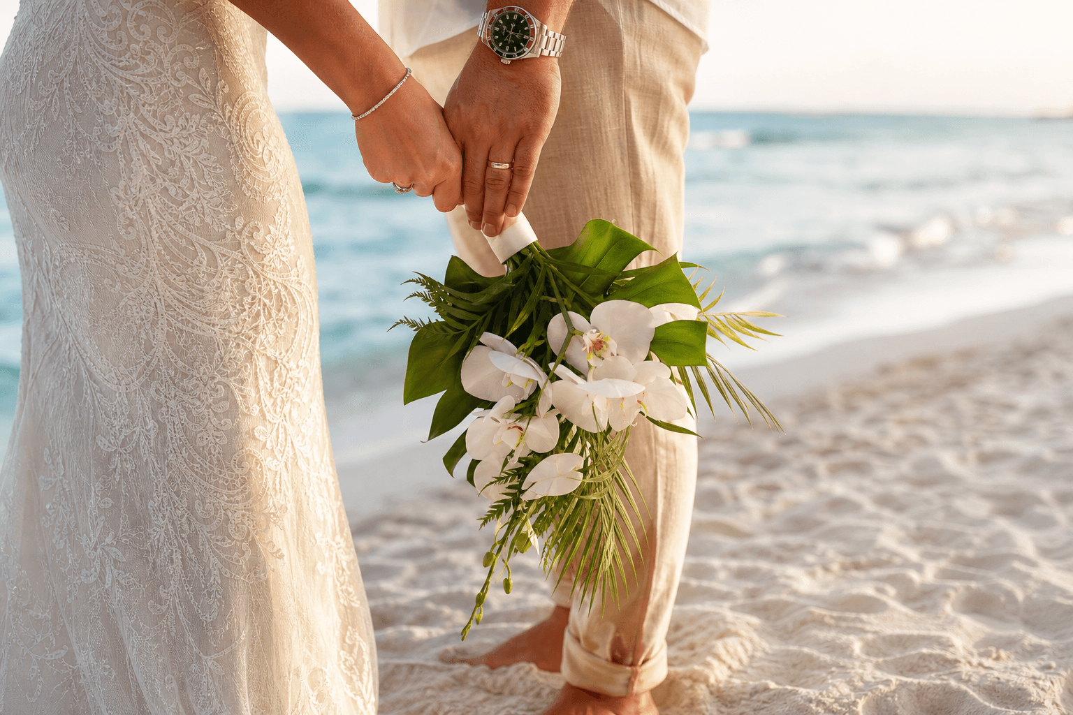 Bride and groom holding hands and a tropical bouquet on the sand at 8th Ave S Wedding Beach, Naples, with Gulf of Mexico waves in the background